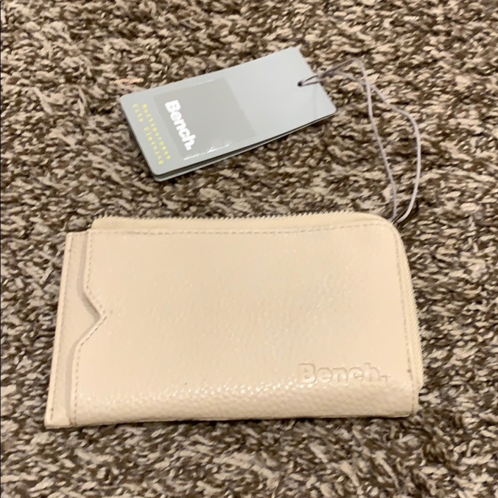 Bench cream colored wallet.